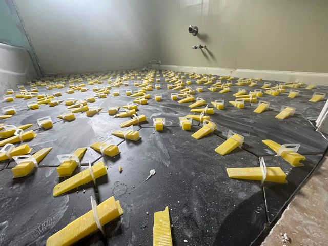 Tile installation in progress.